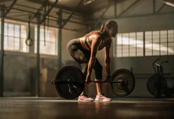 Picture of a woman lifting heavy weight