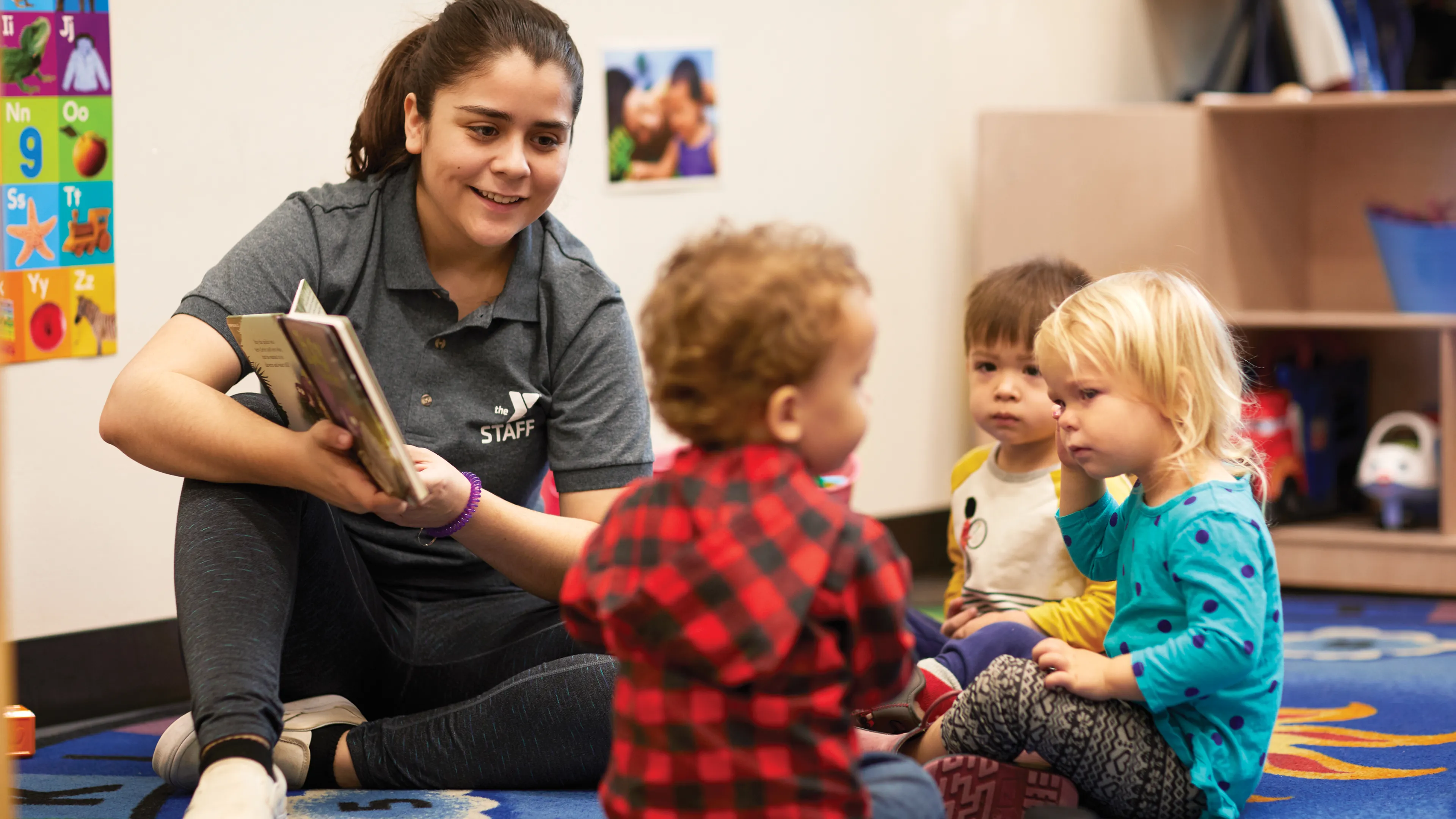 Adult playing with children
