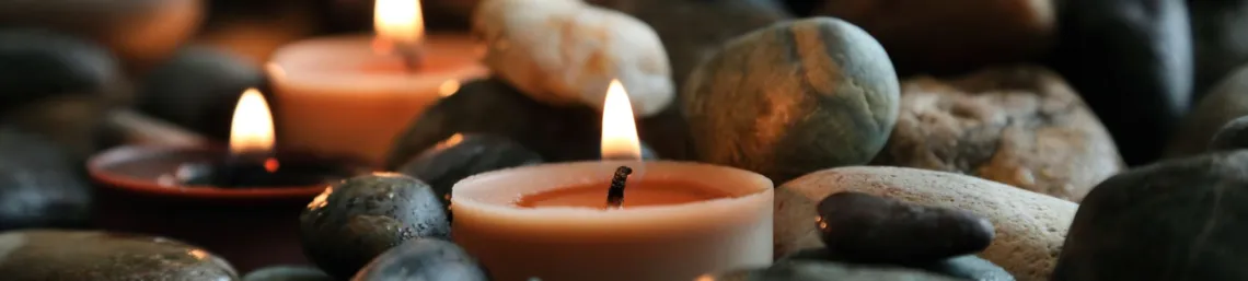 candle nestled in rocks
